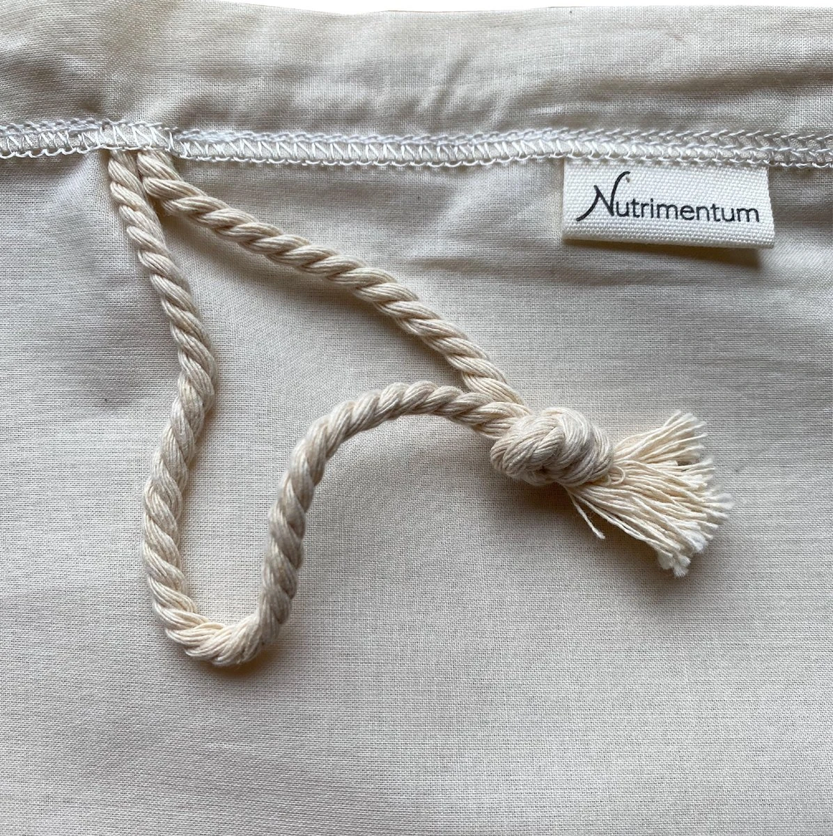 Nutrimentum Nut Milk Bag - Notenmelkzak - Nut Milk Strainer - 100% Biologisch Katoen - Zeefzak - Passeerdoek - 100% Organic Cotton - Kaasdoek - Cheesecloth - Vegan - Zero Waste 2 Nutrimentum Nut Milk Bag - Notenmelkzak - Nut Milk Strainer - 100% Biologisch Katoen - Zeefzak - Passeerdoek - 100% Organic Cotton - Kaasdoek - Cheesecloth - Vegan - Zero Waste - Afbeelding 2